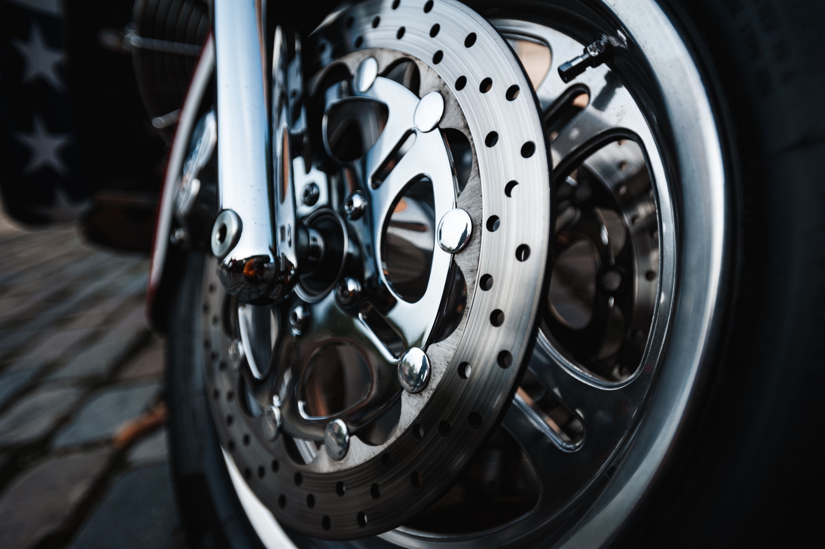 Closeup of a shining motorcycle tire Upgrade your stopping power with our premium braking systems. Explore precision-engineered brake pads, rotors, and calipers built for ultimate safety.